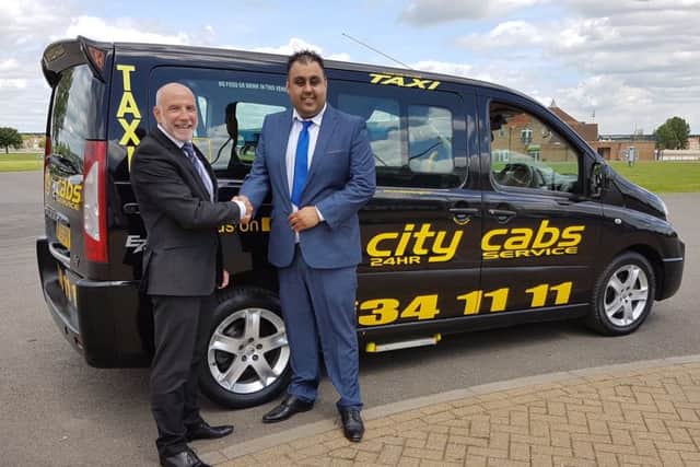From left, Ian Strange,  East of England Arena and Events Centre's commercial manager, with Amjaid Ali,  City Cabs director.