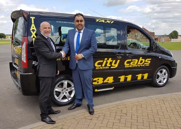 From left, Ian Strange,  East of England Arena and Events Centre's commercial manager, with Amjaid Ali,  City Cabs director.