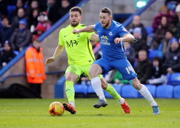 Conor Washington will be back in action at the ABAX Stadium with QPR in July.