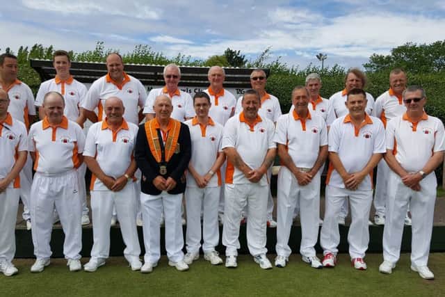 The Adams Trophy team pictured before their home defeat at the hands of Suffolk at Whittlesey Manor on Saturday. (Back row, left to right): Jonathan Earl, Jack Corney, Lee Welsford, Rod Maplethorpe, Martyn Dolby, Peter Brown, Steve Lander, Paul Bailey, Martin Welsford. (Front row): Wayne Morris, John Holroyd, Tony Belson, county president Tony Mace, Adam Warrington, Steve Roden, Roger Stevens, deputy president Dick Noble, Graham Agger.