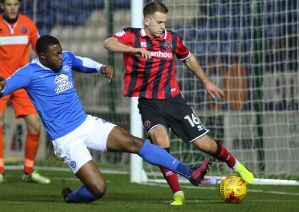 Posh left-back Jerome Binnom-Williams (left) is expected to leave the club soon.
