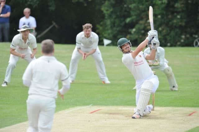 Hanno Kotze of Oundle hits a huge six in the game against Rushton. He was dismissed next ball. Photo: David Lowndes.