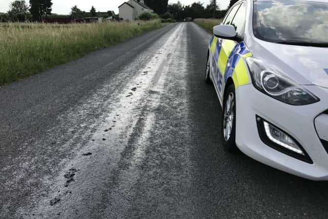 Police are at the scene of the melting road this evening