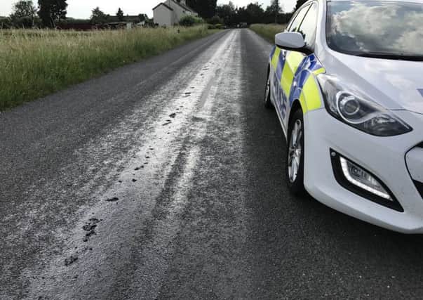 Police are at the scene of the melting road this evening