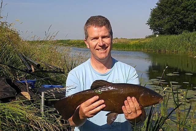 An early first-day tench, one of seven taken from the Twenty Foot Drain by Geoff Rogers.