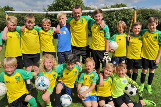 Darren Gibbons is pictured at the presentations with his talented crop of young keepers.