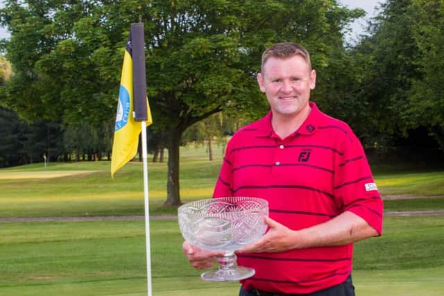 Stuart Brown with his prize for winning the PGA Order of Merit event at Bentley. Photo: Tony Rushmer.