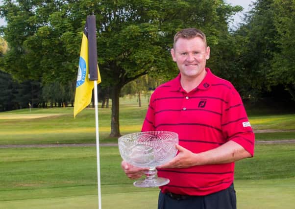 Stuart Brown with his prize for winning the PGA Order of Merit event at Bentley. Photo: Tony Rushmer.