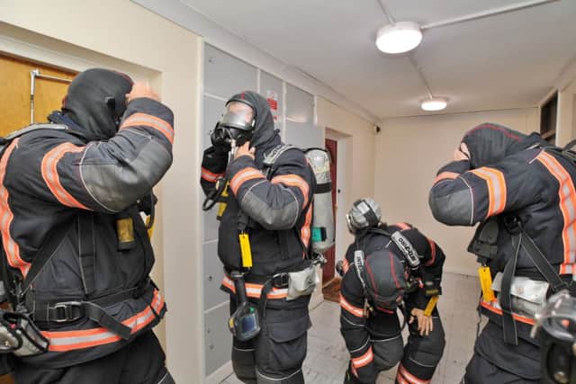 Cambs fire fighters exercise at St Mary's flats. EMN-170622-204416009