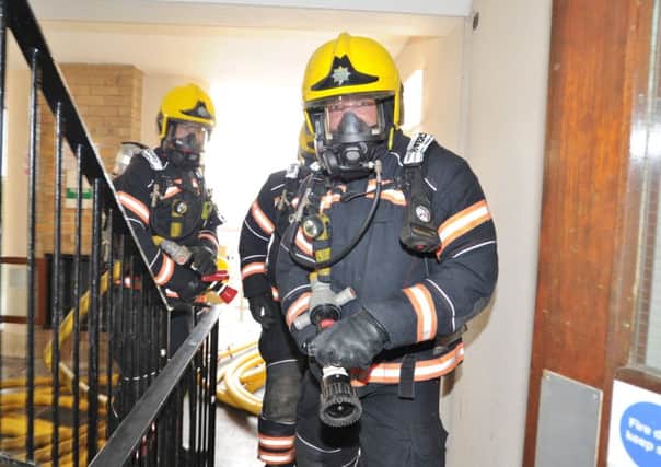 Cambs fire fighters exercise at St Mary's flats. EMN-170622-204515009