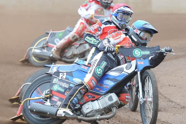 Chris Harris (red helmet) and Bradley Wilson-Dean (blue) on their way to a 5-1 for Panthers in heat one of the meeting with Glasgow. Photo: David Lowndes.