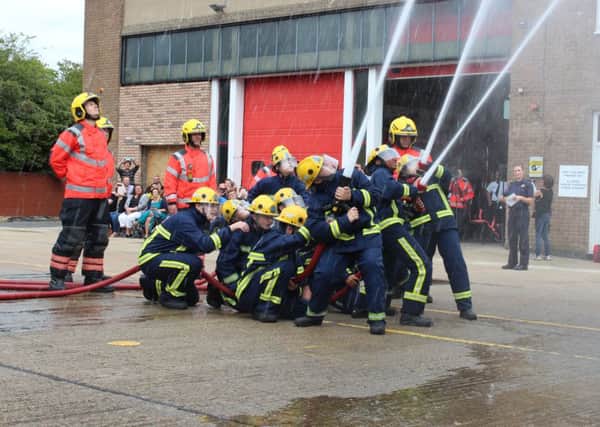 Pupils doing the fire course
