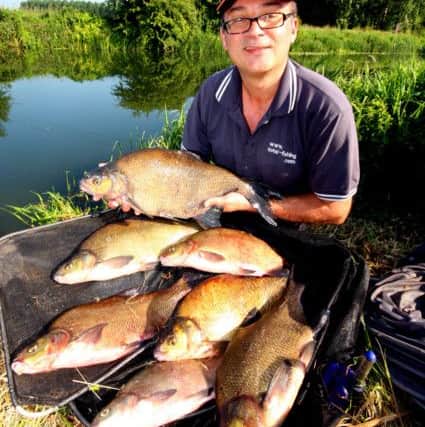 Gareth Purnell with a bream catch from the River Nene.