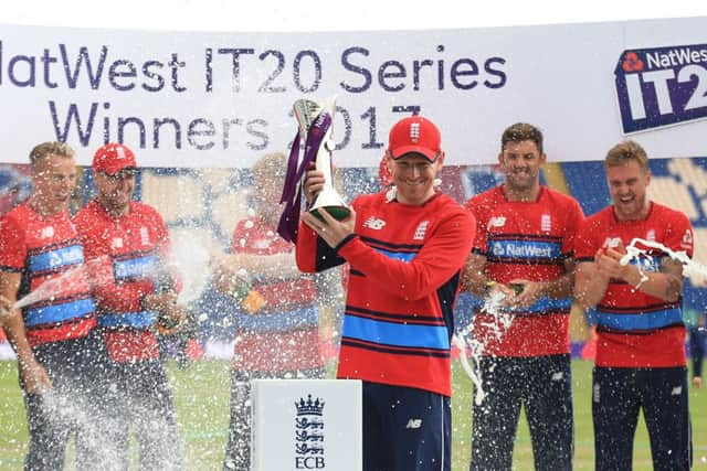 Eoin Morgan with an irrelevant trophy.