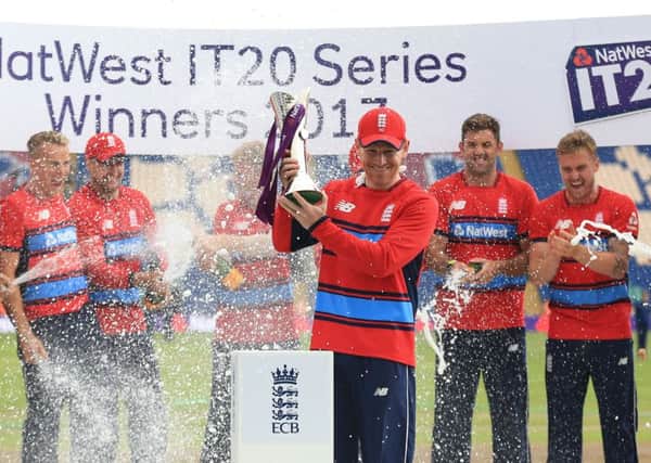 Eoin Morgan with an irrelevant trophy.