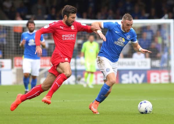 Michael Doughty (left) in action for Swindon at the ABAX Stadium.