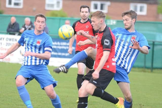 Action from last season's President's Shield Final between Netherton United (red) and Pinchbeck.