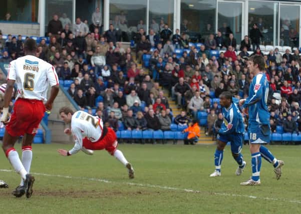 Aaron Mclean scores for Posh against Lincoln.