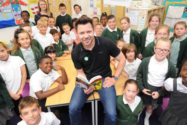 Childrens author Guy Bass reading stories to year 4 pupils at Woodston primary school. EMN-170626-213411009
