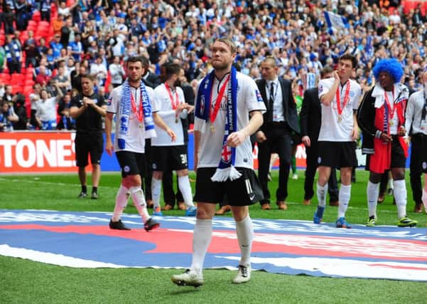 Current Posh manager Grant McCcann savours the Football League Trophy Final win over Chesterfield at Wembley.
