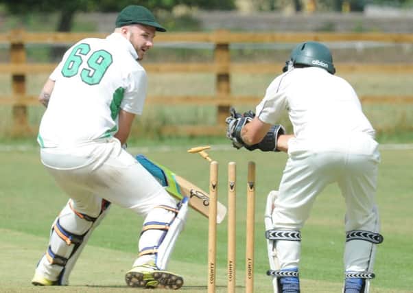 Castor's Ryan Evans is stumped by Tim Starmer of Ufford Park after making 27. Photo: David Lowndes.