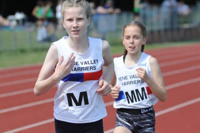 Lottie Hemmings and Chelsea Bole in 1500m action.