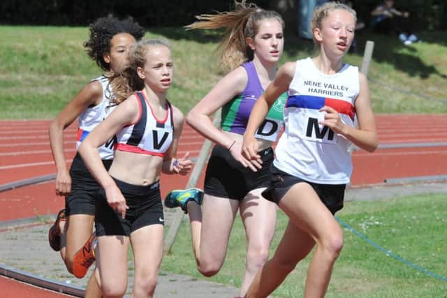Flo Brill on her way to a win in the Under 15 1500m .