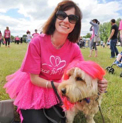 Race for Life 2017 at Ferry Meadows. Runner Lisa Cooper with her dog Ralph EMN-170207-194915009