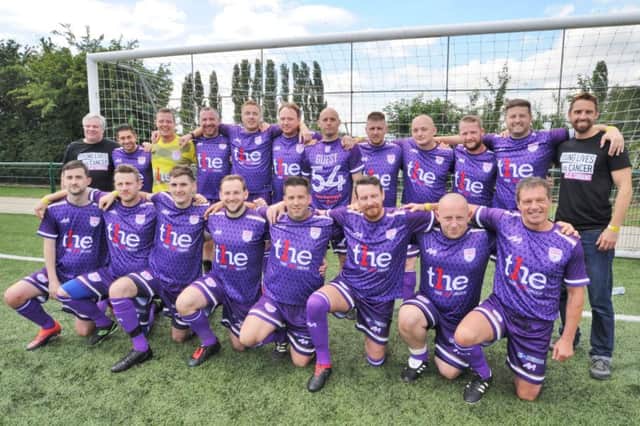 Peterborough v Cancer chaity football match at Yaxley FC. The Peterborough players team EMN-170107-192509009