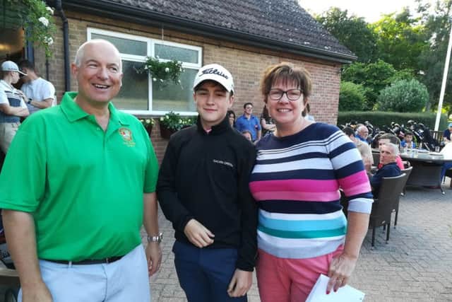Peterborough Milton captain Ian Smith with the winners of the clubs recent Adult-Junior Competition Adam OBrien and Angela Boxall.