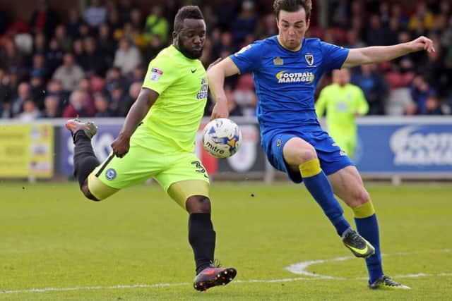 Junior Morias in action for Posh against AFC Wimbledon.