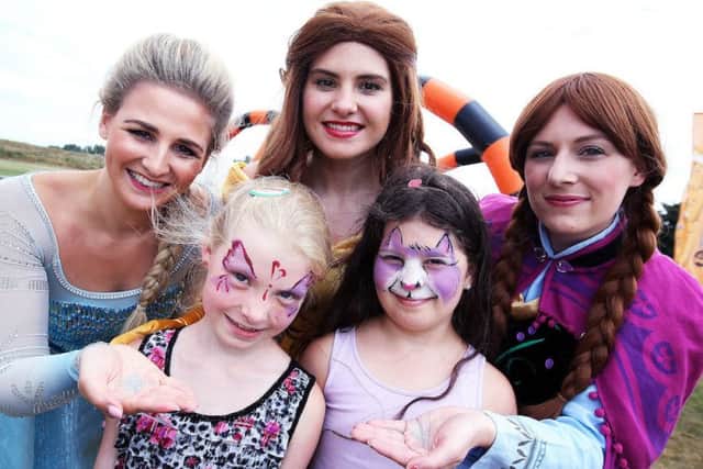 From left, Elsa, Zofia (5), Belle, Gabrielle (8) and Anna (Disney characters) at the family fun day. © Tim George/ UNP 0845 600 7737
36961