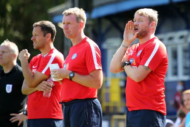 Posh boss Grant McCann issuing orders at St Albans. To his left are assistant manager David Oldfield and goalkeeping coach Mark Tyler. Photo: Joe Dent/theposh.com.