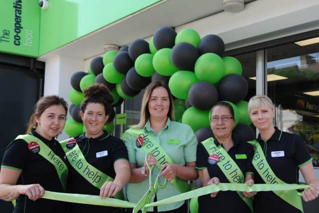 The team from the Mayor's Walk store celebrate the revamp relaunch.
