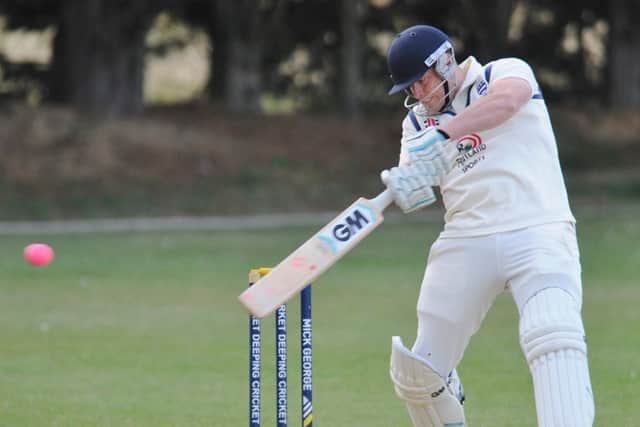 Man-of-the-match Tom Dixon hits out on his way to 37 for Bourne against King's Keys. Photo: David Lowndes.