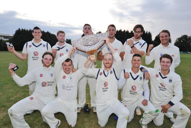 Bourne celebrate their Stamford KO Shield Final success.