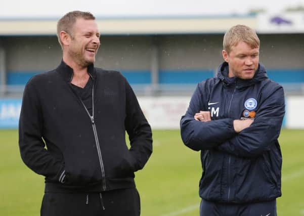 Posh manager Grant McCann (right) with chairman Darragh MacAnthony before the game at Nuneaton. Photo: Joe Dent/theposh.com.