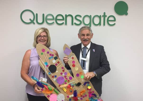 Carol Wakelin and Frank Grant from Queensgate's management team with the entry from St.Michaels Pre School.