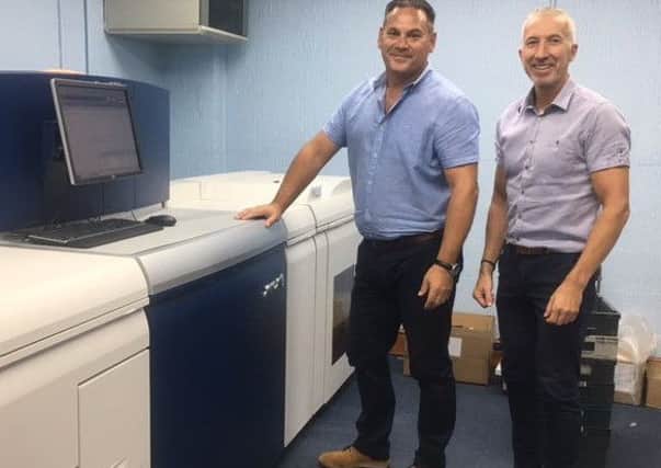 From left, directors Kevin Brown and Stuart Speechley with the new Xerox Versant 3100 digital press.