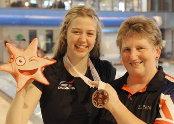 Isabel Spinley shows off her European bronze medal with Deepings SC head coach Lynn Chapman.