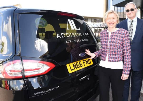 Addison Lee's chief operating officer Catherine Faires with Peterborough City Council leader Cllr John Holdich.