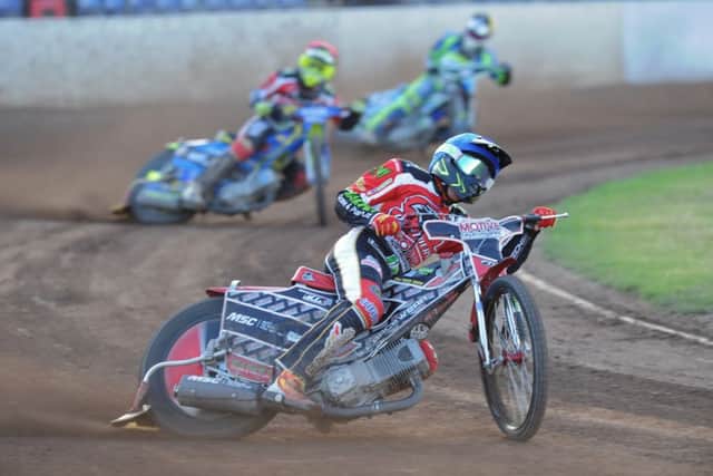 Heat four from Panthers v Sheffield with Chris Harris (red helmet) and Tom Bacon (blue) riding for the home side. Photo: David Lowndes.