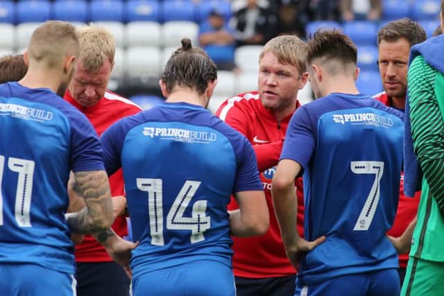 Posh manager Grant McCann instructs his players during a break in the QPR match. Photo: Joe Dent/theposh.com.