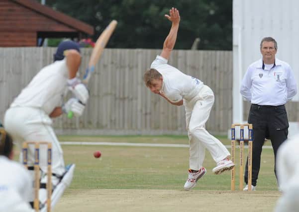 David Sayer bowling quickly for Peterborough Town against Stony Stratford. Photo: David Lowndes.