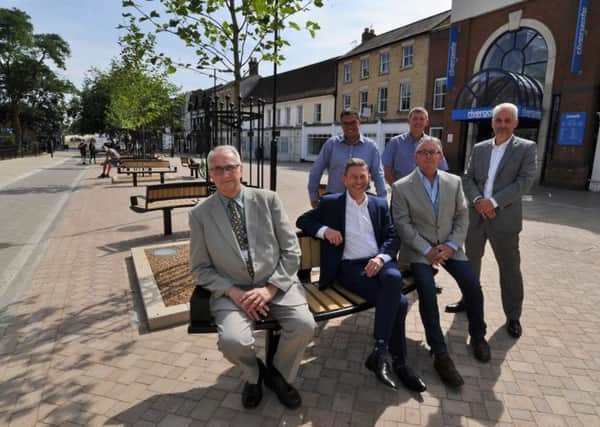 Coun John Holdich, Peter Hiller and Steve Allen with  Simon Machen (city council), David Edevane (Skanska) and at the back Chris Bower (Durman Stearn - wearing glasses) looking at the completed work at Lower Bridge Street EMN-170717-163223009