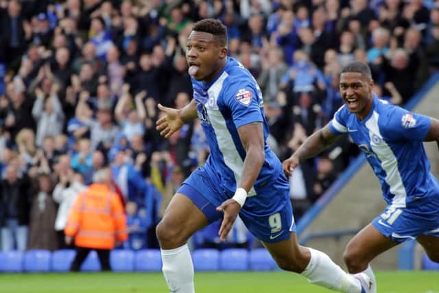 Britt Assombalonga celebrates another Posh goal.