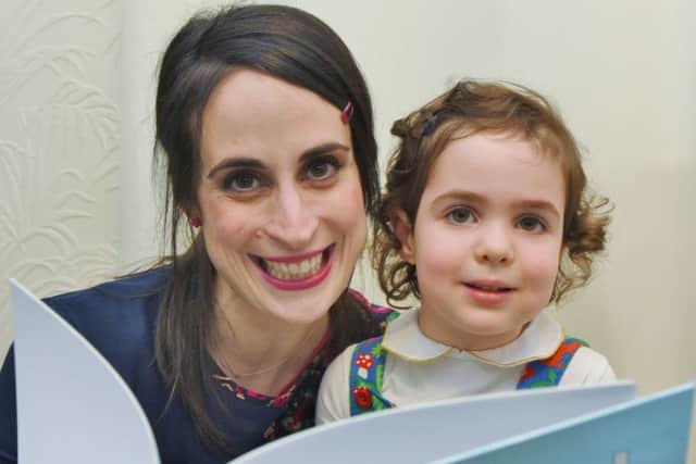 Childrens' author Sayeh Stone at home with her daughter Soheyla (4) looking at her new book EMN-170220-193157009