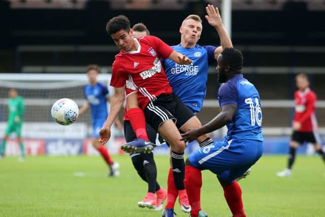 Harry Anderson in the thick of the action for Posh against Ipswich. Photo: Joe Dent/theposh.com.