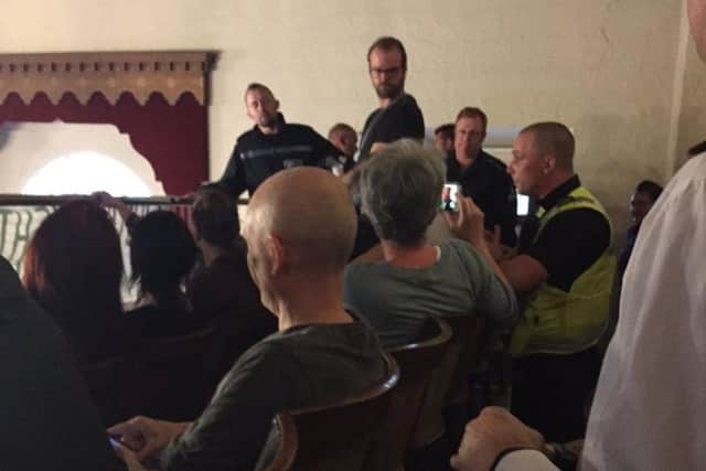 Police in the public gallery at tonight's meeting