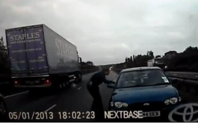 Off duty PCSO Sallie Lunness tries to stop Tahir Khalil after he pulled a U-turn on the Fletton Parkway